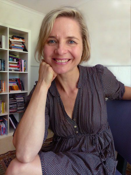 Author Sofie Laguna in front of a bookshelf