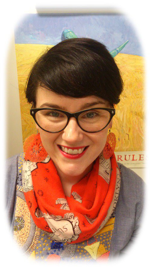 Suzanne O'Sullivan wearing black framed glasses and an orange scarf